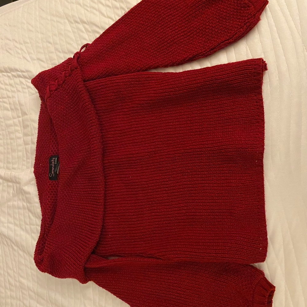 Red off the shoulder cropped sweater.